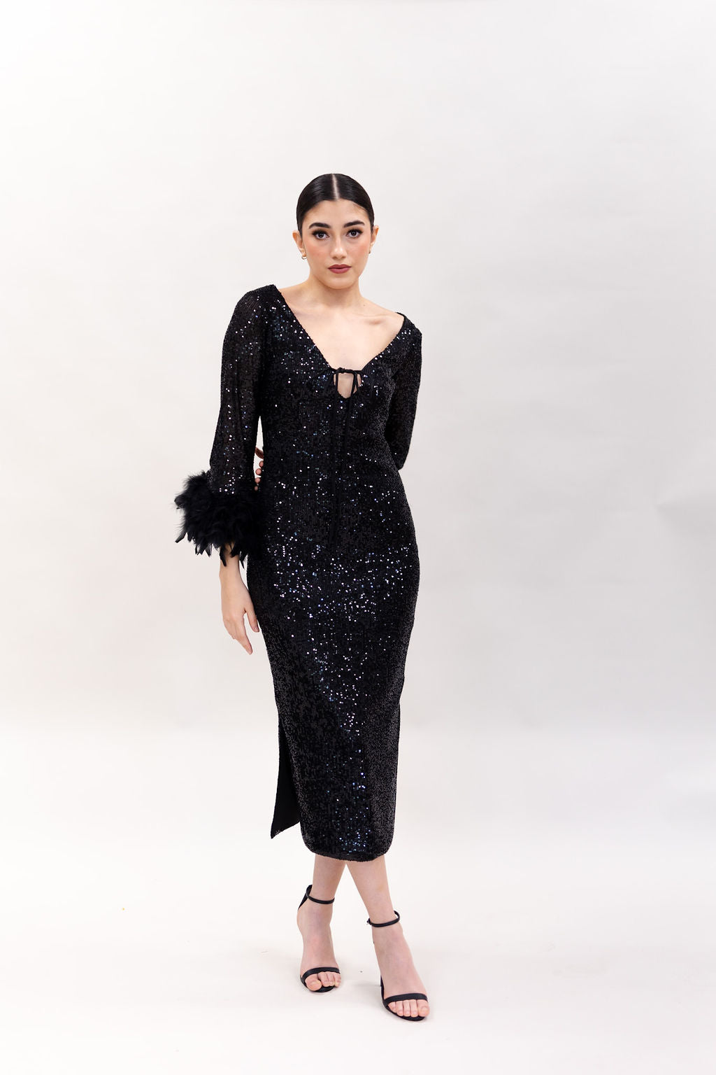 THE SEQUIN BLACK DRESS WITH FEATHERS