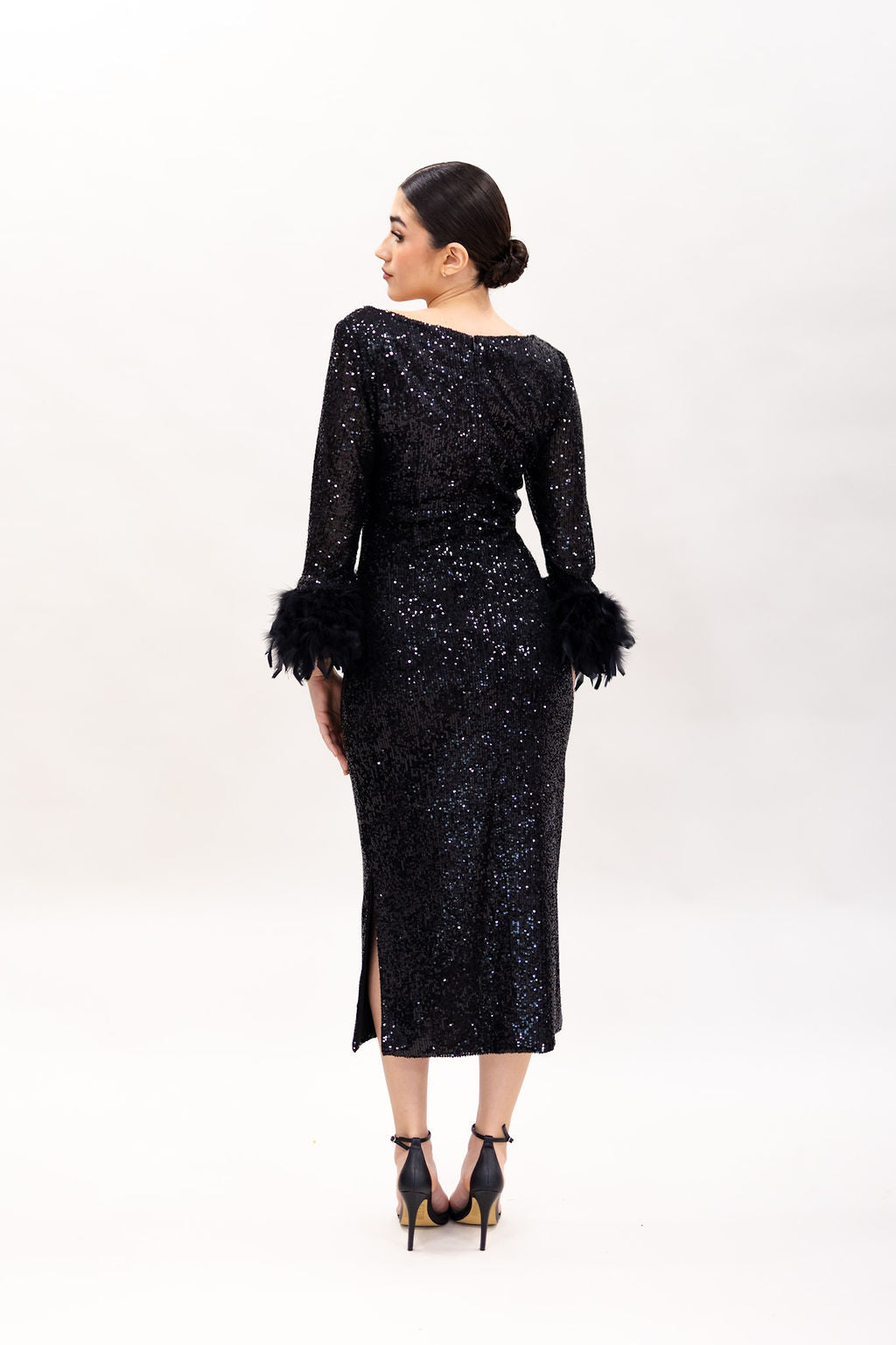 THE SEQUIN BLACK DRESS WITH FEATHERS