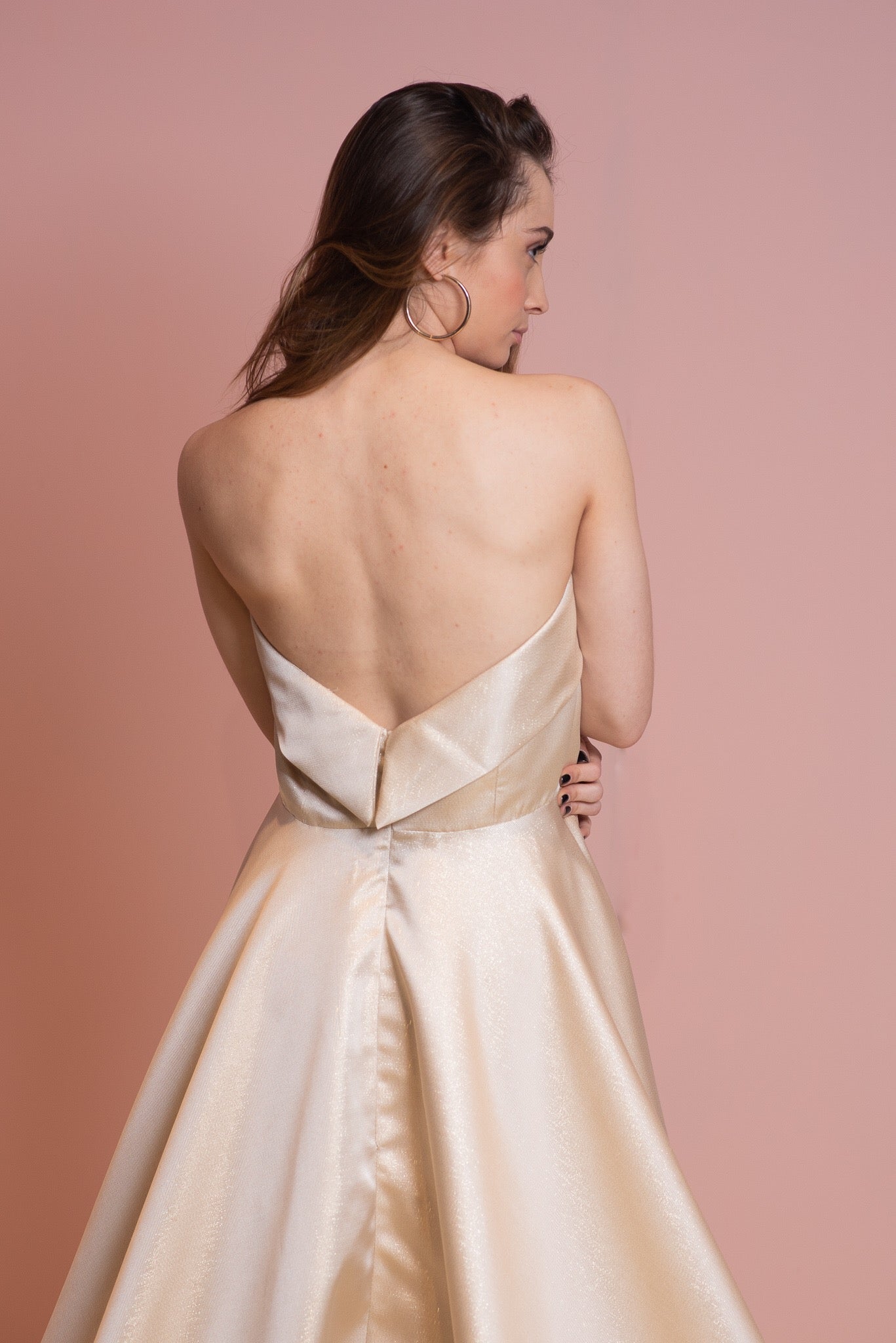 Low back gold strapless ballgown